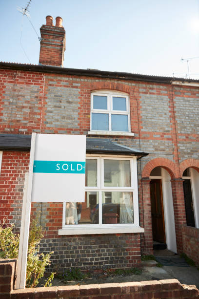 istock Real Estate Sold Board Outside Terraced House 1083736500