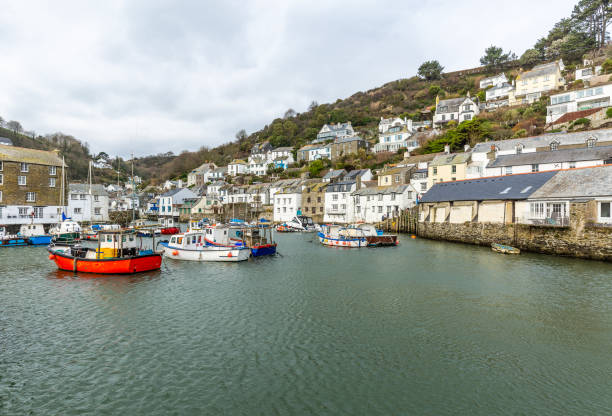 istock Bright Red Fishing Boat moord in Polperro Harbour, Cornwall, UK 1083738578