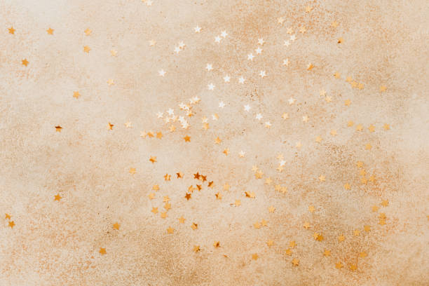 istock Beige stone background with golden stars on in. 1083747258