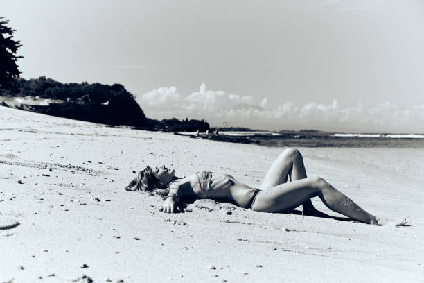 istock Slim woman enjoying on a sandy tropical beach. 1083749882
