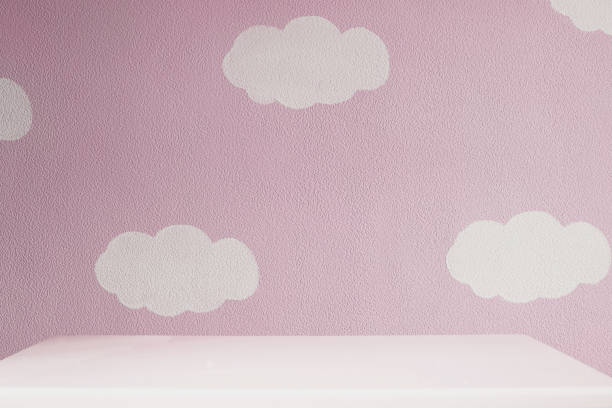 pink wall and empty white table in girls room