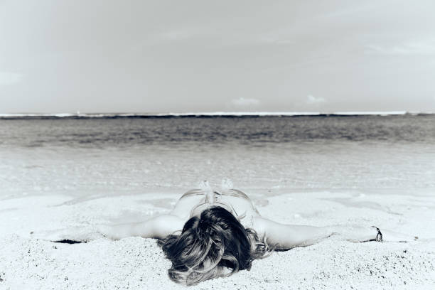istock Slim woman enjoying on a sandy tropical beach. 1083754526