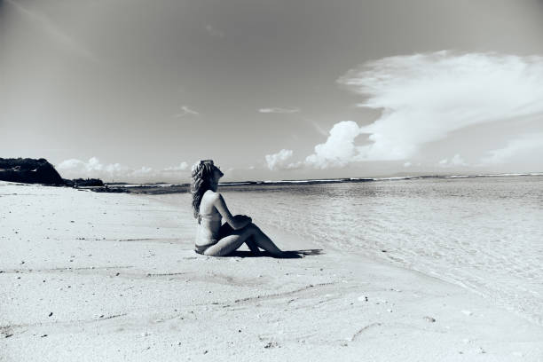 istock Slim woman enjoying on a sandy tropical beach. 1083755194