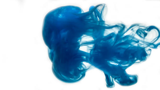 istock Abstract pattern falling into the water drop of blue ink 1083755380