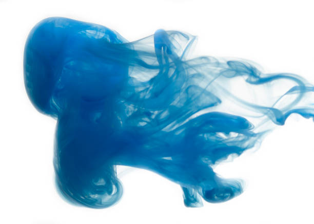 istock Abstract pattern falling into the water drop of blue ink 1083755406