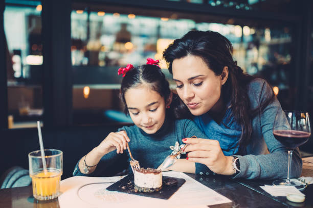 istock Family eating in restaurant 1083759384