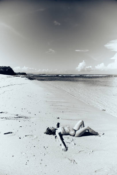 istock Slim woman enjoying on a sandy tropical beach. 1083761454