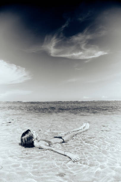 istock Slim woman enjoying on a sandy tropical beach. 1083761776