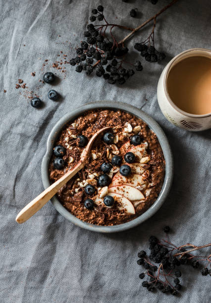 istock Served  healthy vegetarian breakfast - chocolate overnight oats and coffee on a grey background, top view. Flat lay, copy space 1083761840