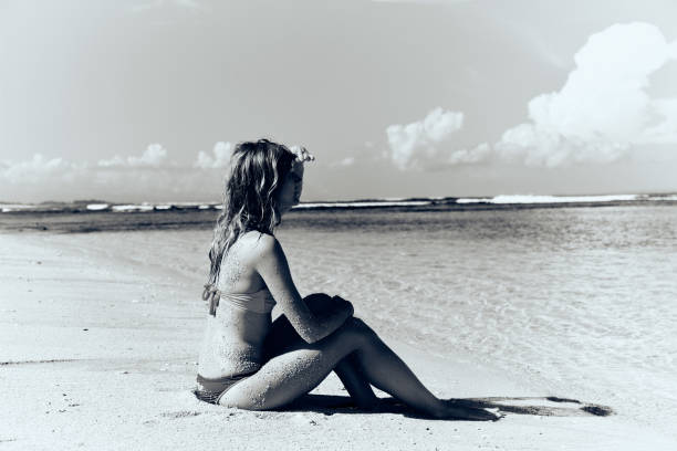 istock Slim woman enjoying on a sandy tropical beach. 1083763048