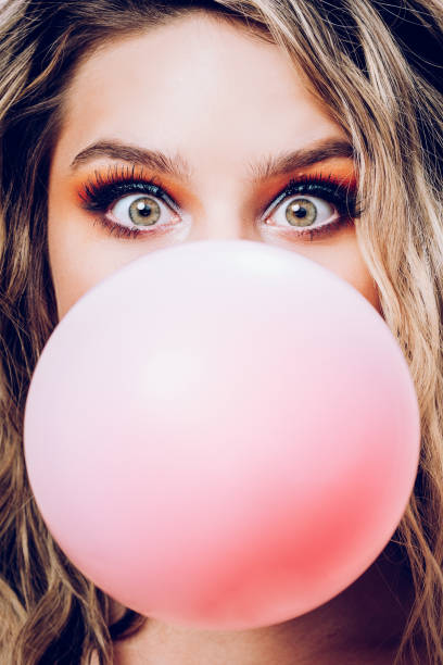 istock Beautiful Bride With Pink Floral Wallpaper And Bubblegum 1083764656