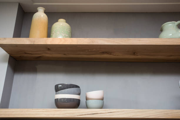 istock Home decor - various neutral colored vases wooden shelf against grey wall. 1083768830