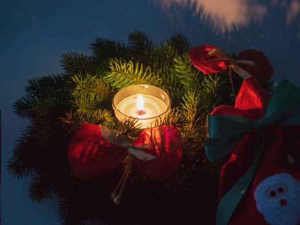 istock Christmas wreath and candle. Selective focus. 1083772294
