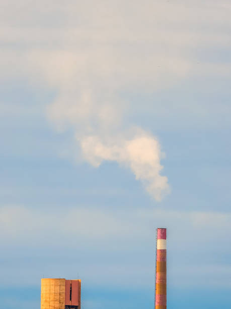 istock A smoking factory pipe against against the blue sky 1083779628