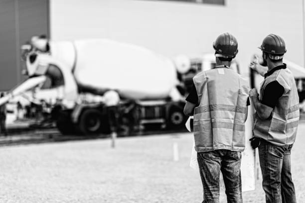 istock Rear View Of Manual Workers Working Outdoors 1083789310