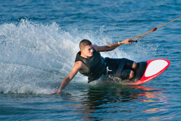 istock Mid Adult Man Kiteboarding On Sea 1083790240