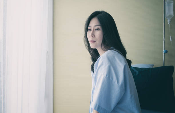 istock Female patient sitting on bed 1083791722