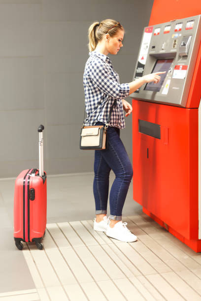 istock Glad woman buying ticket in subway 1083791824