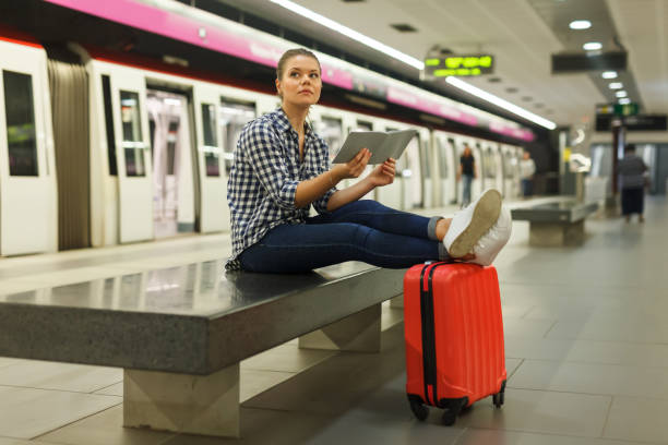 istock Ordinary girl sitting on bench at metro station 1083791848