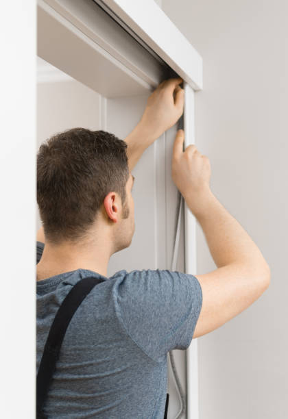 istock Handyman installing sliding door at home. 1083792528