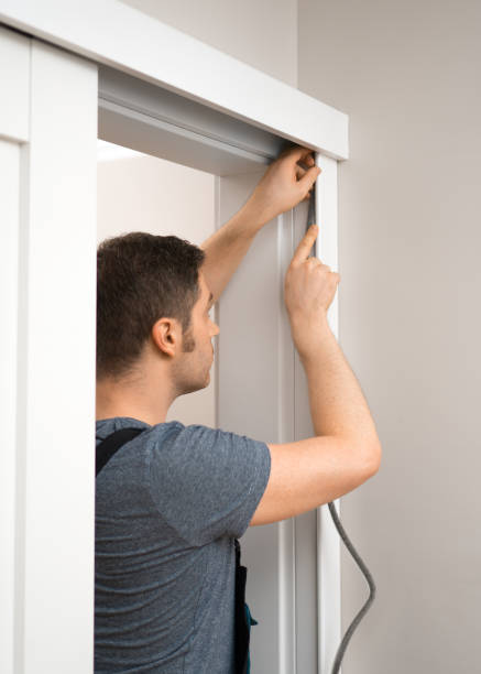 istock Handyman installing sliding door at home. 1083792554