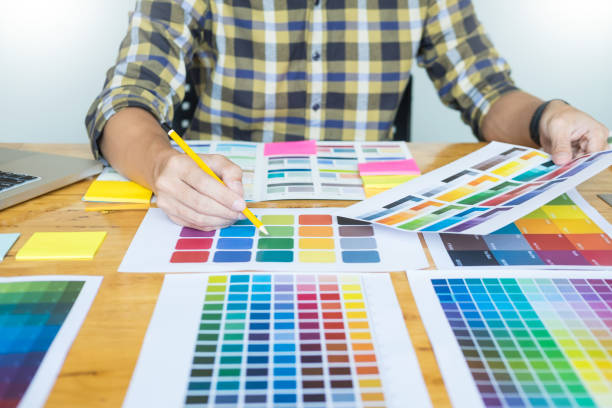 istock Midsection Of Man Analyzing Color Swatch In Office 1083793388