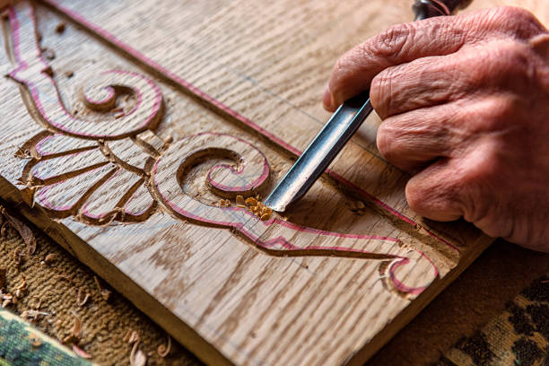 Close-up Shot of Human Hand Carving Sculpture Close-up shot of human hand working on sculpture carpenter carpentry craftsperson carving stock pictures, royalty-free photos & images