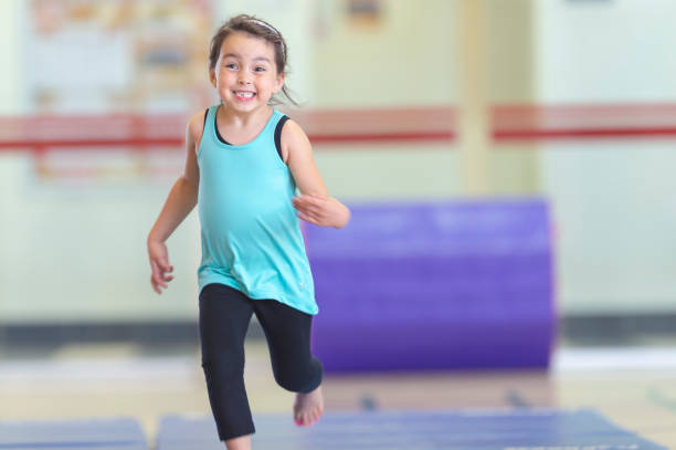 istock Little girl in gymnastics class 1083803584