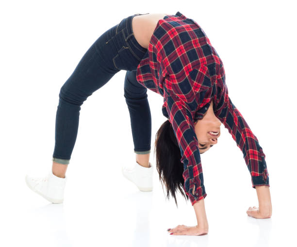 istock Beautiful young latino female bending over backward 1083809634