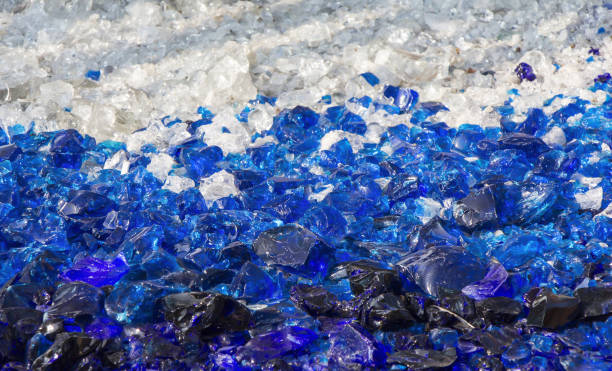 istock Many broken pieces of glass in white and blue, as background 1083812452