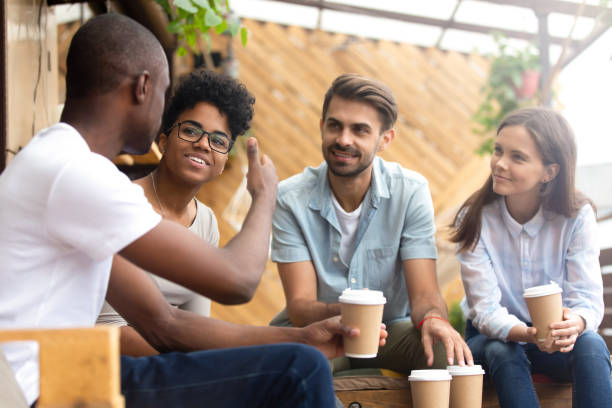 african american man showing thumb up to friends in cafe - family american culture african culture black imagens e fotografias de stock