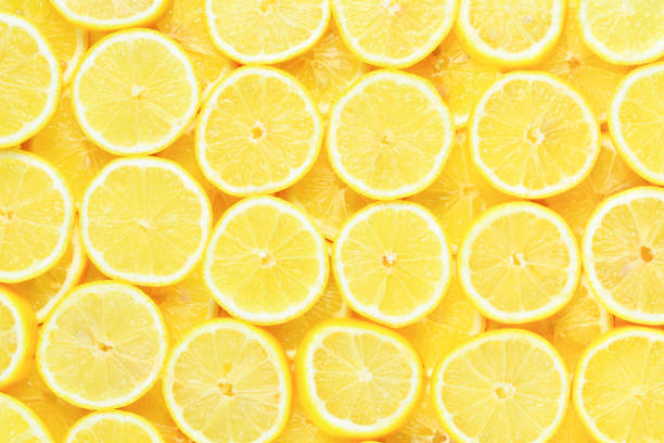 istock A slices of fresh juicy yellow lemons.  Texture background, pattern. 1083815066