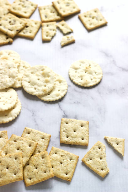 istock Matzo crackers, salty crackers with sesame seeds and flax seeds on a light background. 1083815196
