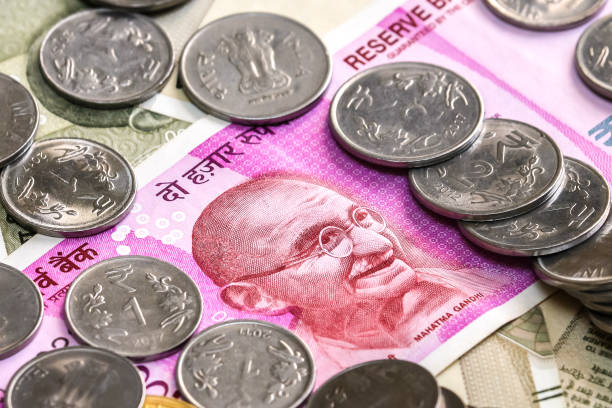 istock New indian 2000 rupees banknote and coins. 500 rupee banknotes in background. 1083818964