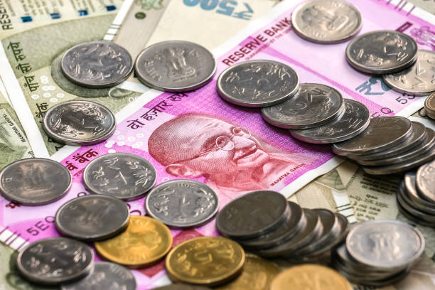 istock New indian 2000 rupees banknote and coins. 500 rupee banknotes in background. 1083818984
