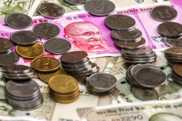 istock New indian 2000 rupees banknote and coins. 500 rupee banknotes in background. 1083819464