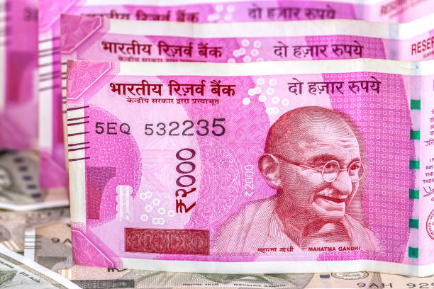 istock New indian 2000 rupees banknotes. 500 rupee banknotes in background. 1083822692