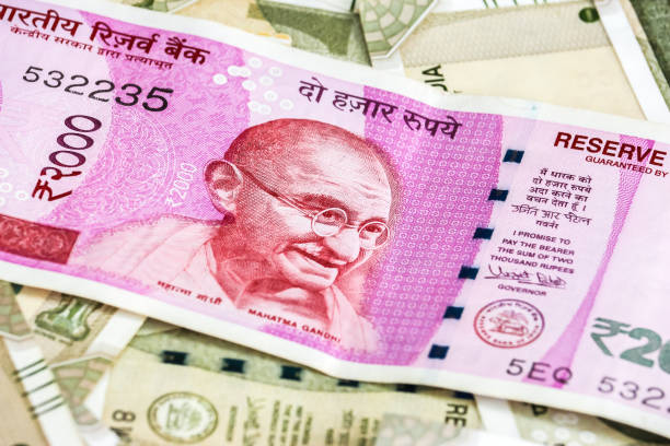 istock New indian 2000 rupees banknotes. 500 rupee banknotes in background. 1083823404