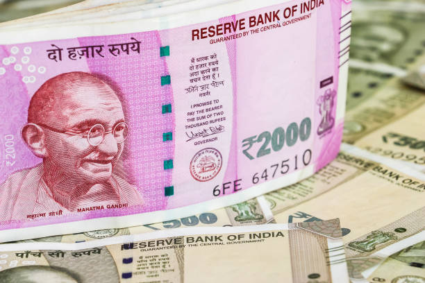 istock New indian 2000 rupees banknotes. 500 rupee banknotes in background. 1083823476