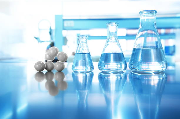 istock glass flask with water and chemical molecular structure on blue science laboratory background 1083824110