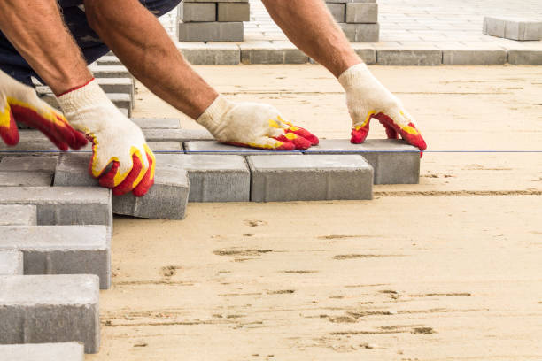 workers lay paving tiles, construction of brick pavement, close up architecture background - paralelepípedo imagens e fotografias de stock