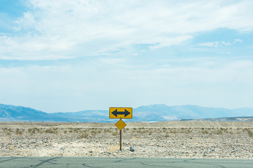 Arrow sign near the road in Death Valley National Park
