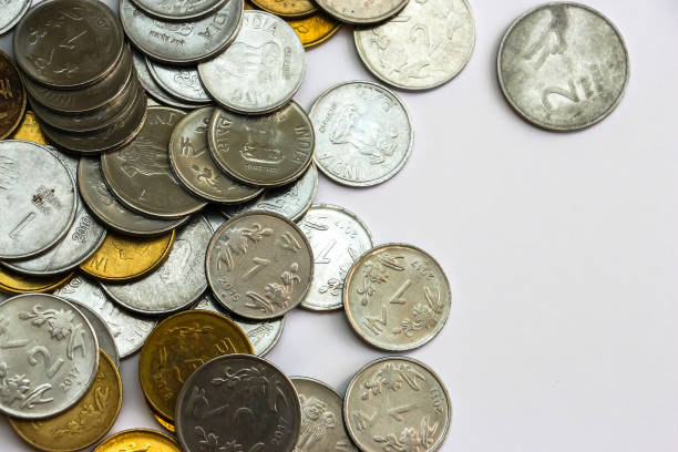 istock Indian rupees coins on white background. 1083827548