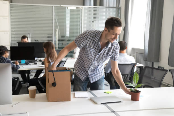istock Happy young office worker, intern unpack belongings at workplace 1083827658