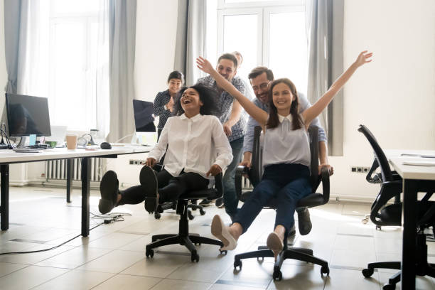 istock Happy multiracial colleagues group having fun together in office 1083827824