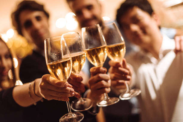istock friends drinking wine at home 1083828226