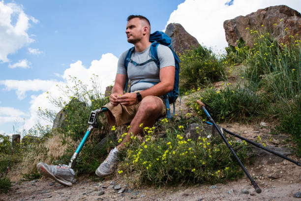 istock Thoughtful man with prosthesis resting in harmony with nature 1083829814