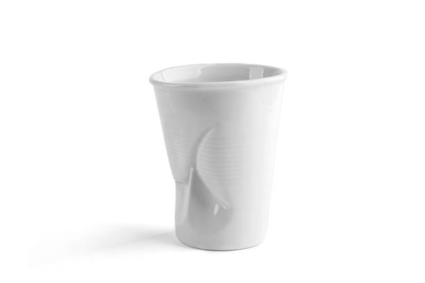 istock Design crumpled ceramic coffee cup as plastic one time cup isolated on white background. 1083830174