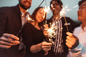 friends celebrate the new year on the rooftop