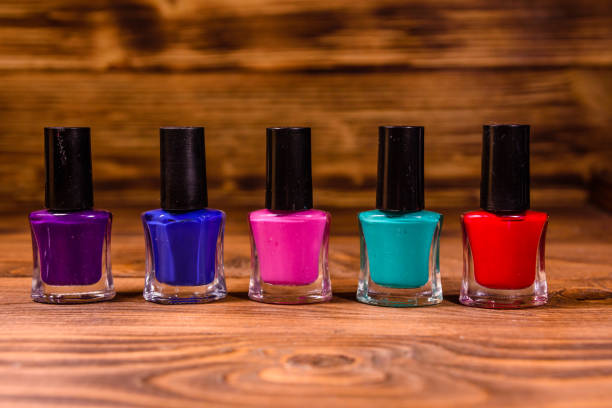 istock Different nail polishes on a wooden table 1083840514